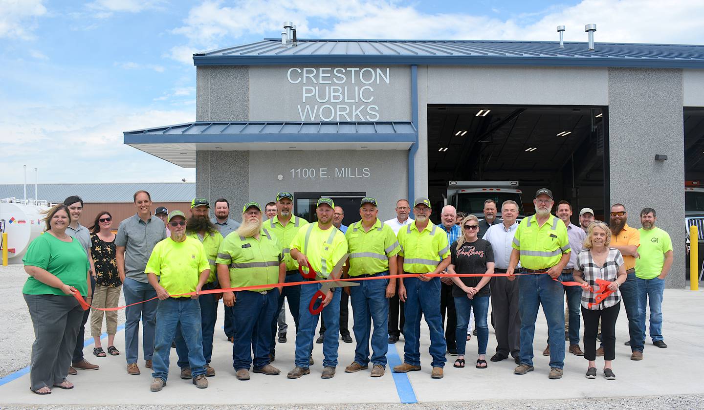 Members of Creston Public Works line up front-and-center for the building's ribbon-cutting on Wednesday, June 12.