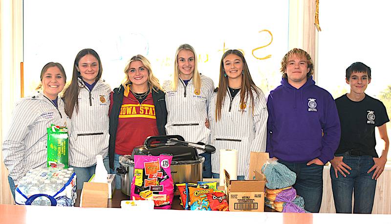 Students serving food during a Feed the Farmer event in Fontanelle were from left, Delaney Blomme, Abbigail Zenor, Kynnady Van Eaton, Bailey Carstens, Chloe Rardin, Charles Rudolf and Dax Crees.