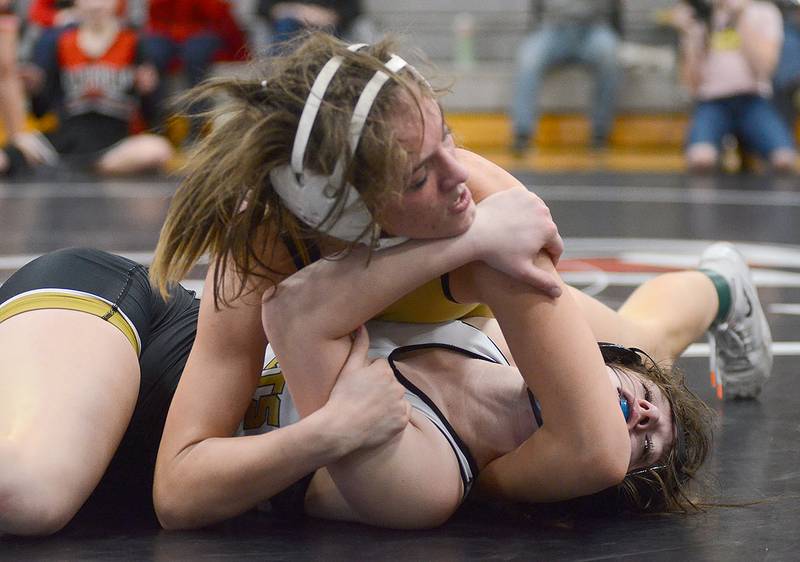 Creston's Karlie Kruse locks up a pin against Kendra Krause of Eddyville-Blakesburg-Fremont in the 125-pound championship match at Thursday's Creston Girls Invitational. Kruse won by two falls and a major decision.