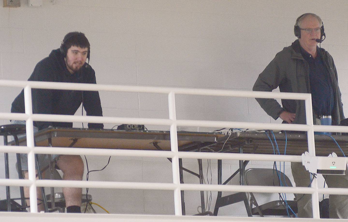 Student broadcaster Reece Hayes (left) broadcasts a girls regional basketball game at Southwest Valley alongside former KSIB sportscaster Stuart Johnson, now with KAAN in Bethany, Missouri.