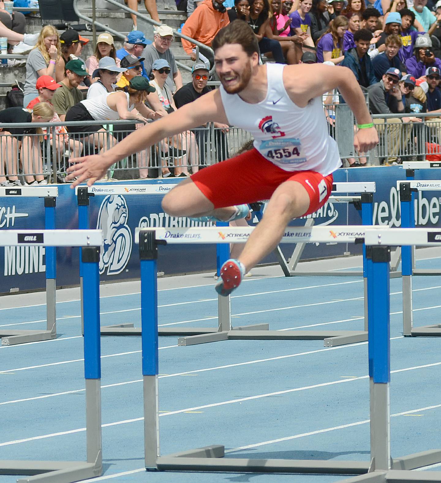 Sam Foreman clears a hurdle duiring Southwestern's shuttle hurdle relay race Saturday. The Spartans placed 11th in the university/college division in a school-record time of 1:04.44.