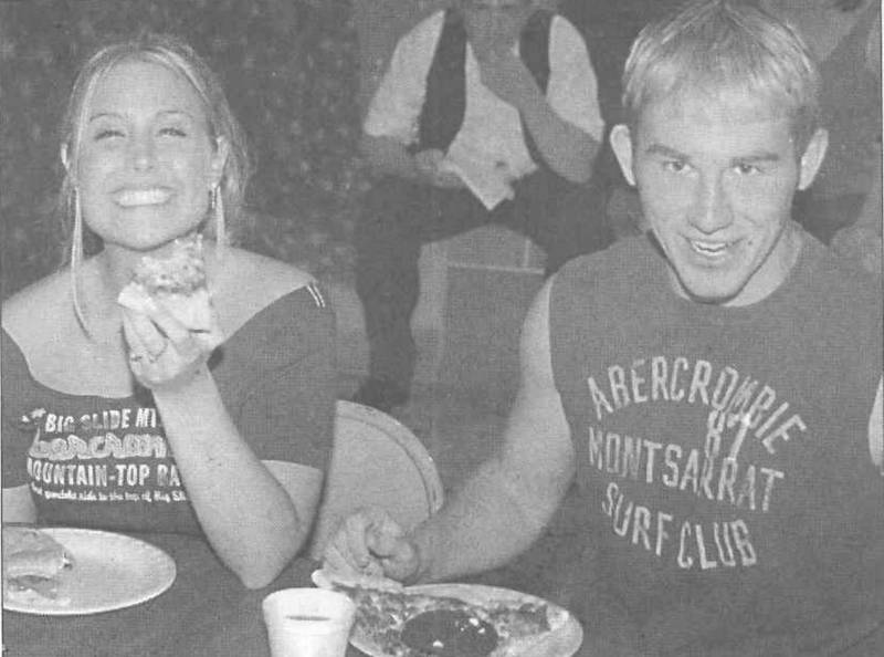 Amanda Miller and Michael Buck enjoy a bite to eat during after-prom festivities.