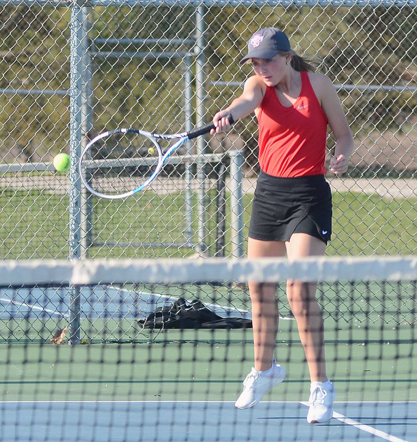 Creston's Ava Adamson sends a serve into the Chariton court during doubles play. Adamson also won 8-0 at No. 1 singles before teaming with Kennedy Strider for the doubles victory.