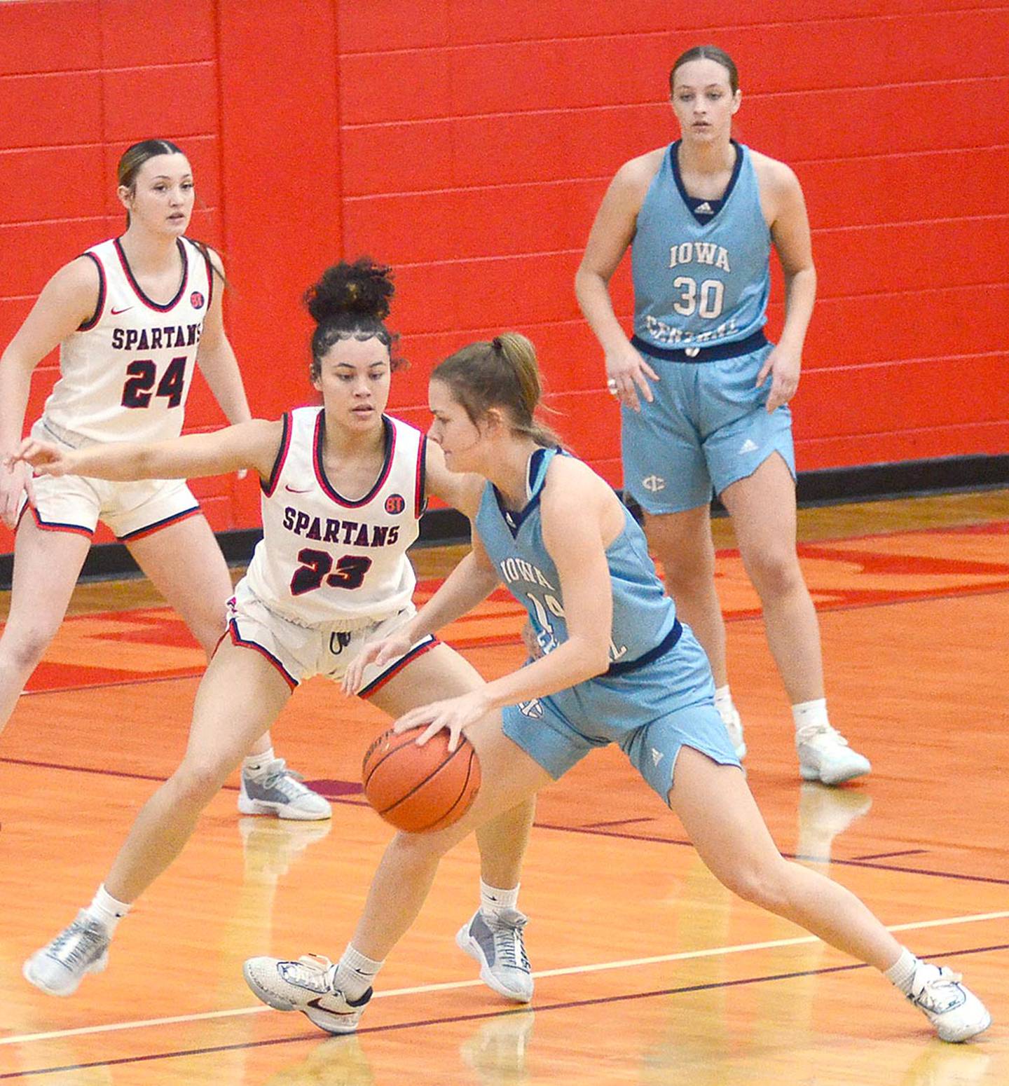 Shyla Moore (23), one of Southwestern's top perimeter defenders, stalks Iowa Central's Laney Pilcher during Saturday's game. Moore had six points and four rebounds.