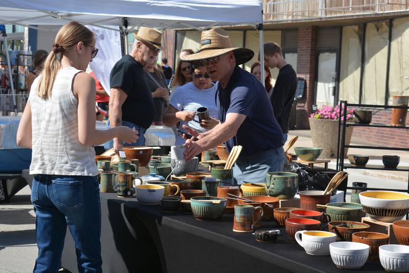 Terry Ferris of Ferris Pottery shows off some of his homemade wears at last year's Market on Maple. Ferris is one of almost 50 vendors scheduled for the event this year.