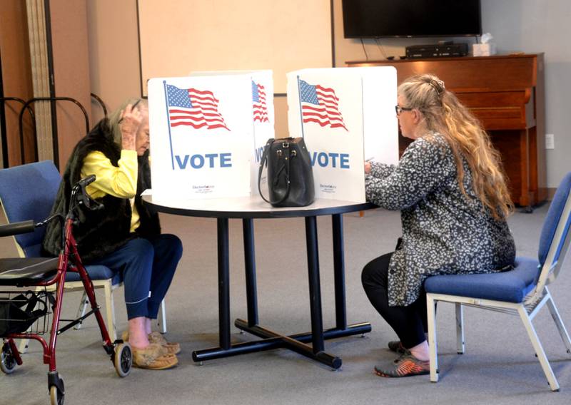 Voters fill their ballots Tuesday at Crest Baptist Church in Creston. Union County races were uncontested.