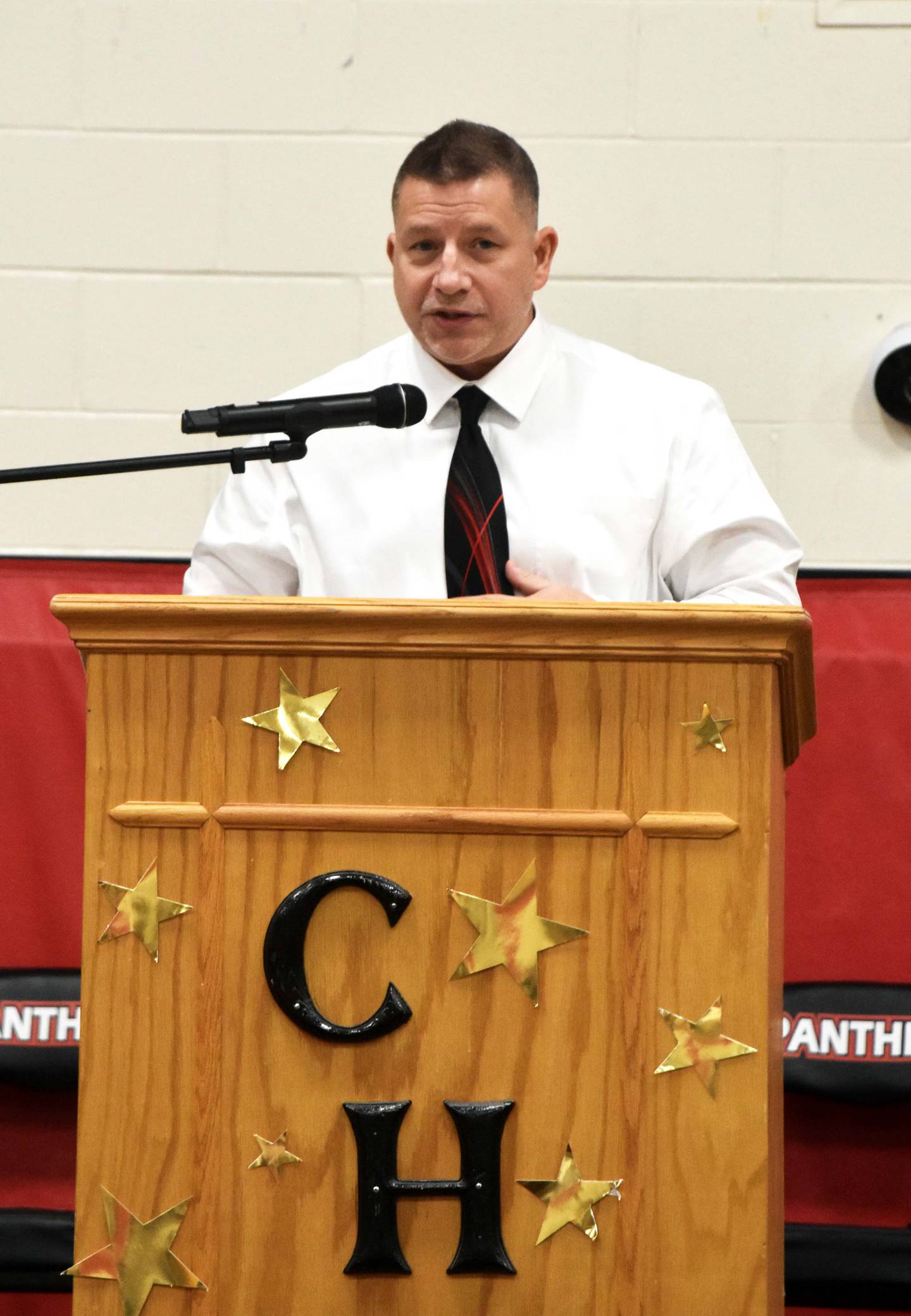 Creston Army veteran and teacher Todd Jacobson speaks to students during the Veterans Day program.