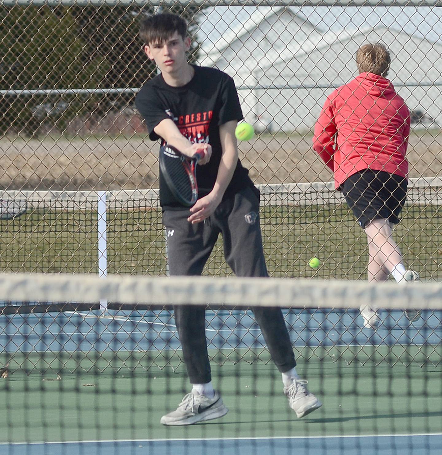 Creston's Gavin Millslagle hits a forehand shot against Audubon during his 8-3 victory at No. 2 singles on Friday. Millslagle also teamed with Lucas Rushing for an 8-4 win at No. 1 doubles.