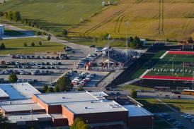 High school tennis courts planned to replace part of gravel parking lot