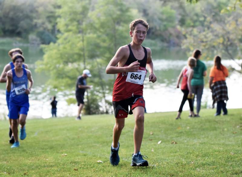 Creston freshman Wyatt Goodenberger powers up a hill Tuesday in Clarke where he finished third for the Panthers in 21:36.40.