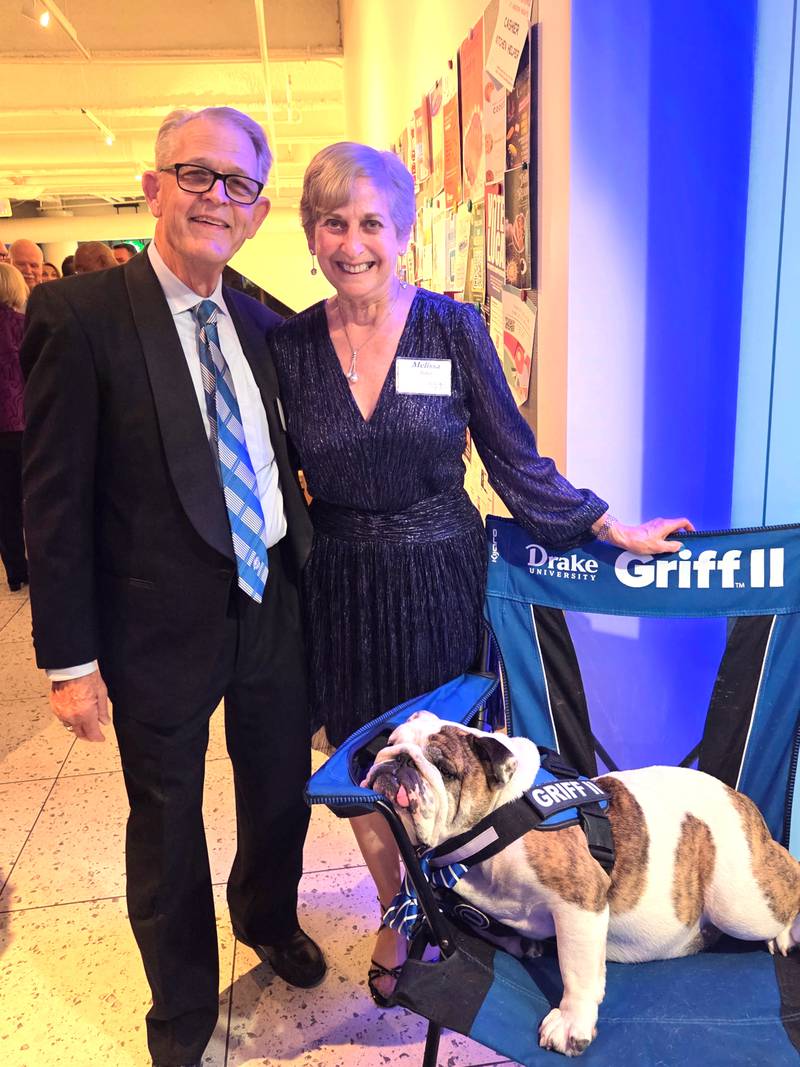 Gary and Melissa Porter with Drake University mascot Griff II, who will retire at the end of this school year. Gary is a Greenfield native.