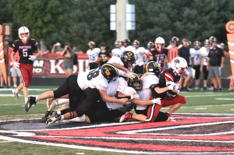 Creston all-state running back Brennan Hayes drags five Winterset defenders for a first down in the second quarter of their matchup Friday. Hayes had 23 carries for 201 yards, four receptions for 36 yards and a rushing touchdown in the 36-17 win over the Huskies.