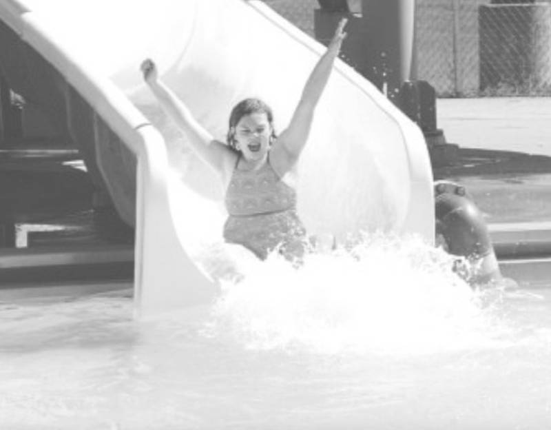 Shelby Schroeder, 12, of Creston, spends  the afternoon of the last day of school Tuesday at McKinley Pool.