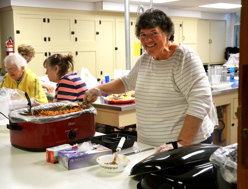 Jane Briley and other members of the United Methodist Church serve up spaghetti Tuesday at Open Table, a free meal for anyone at the Methodist Church. Open Table is the second and fourth Tuesdays at 5 p.m.