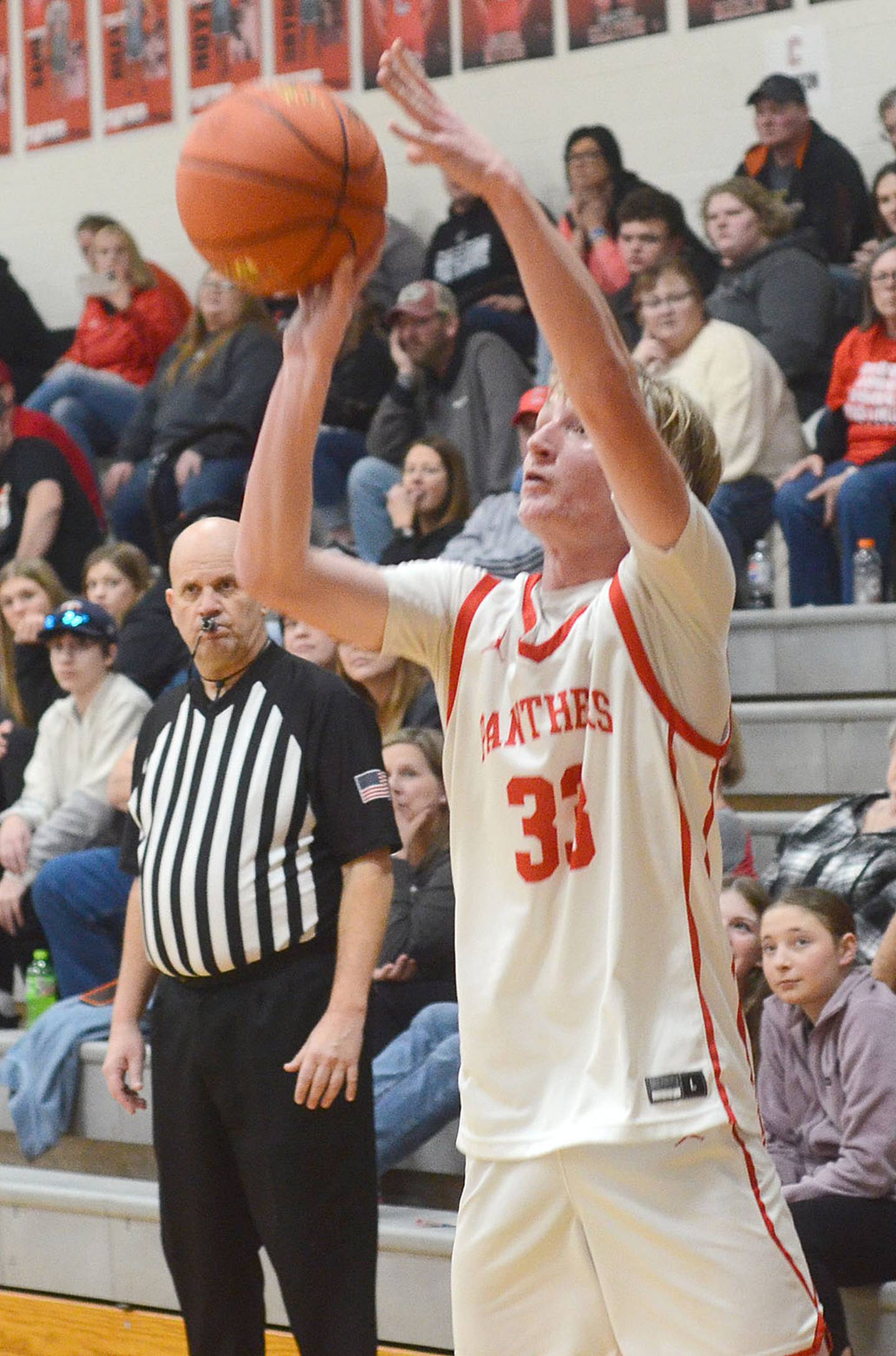 Tommy Sand launches a shot from the corner against Harlan Friday. Sand scored four points in the 60-58 loss.