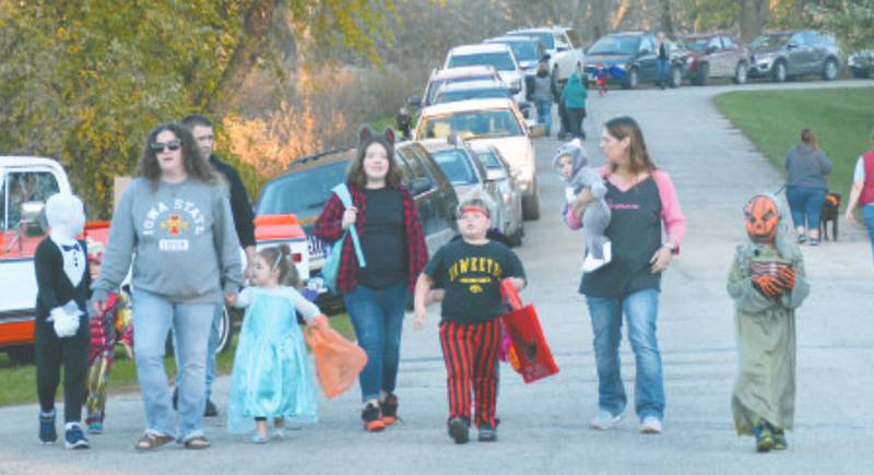 The Donehoo family makes their way into the campgrounds as more than 500 cars line the roads Saturday at Green Valley State Park.