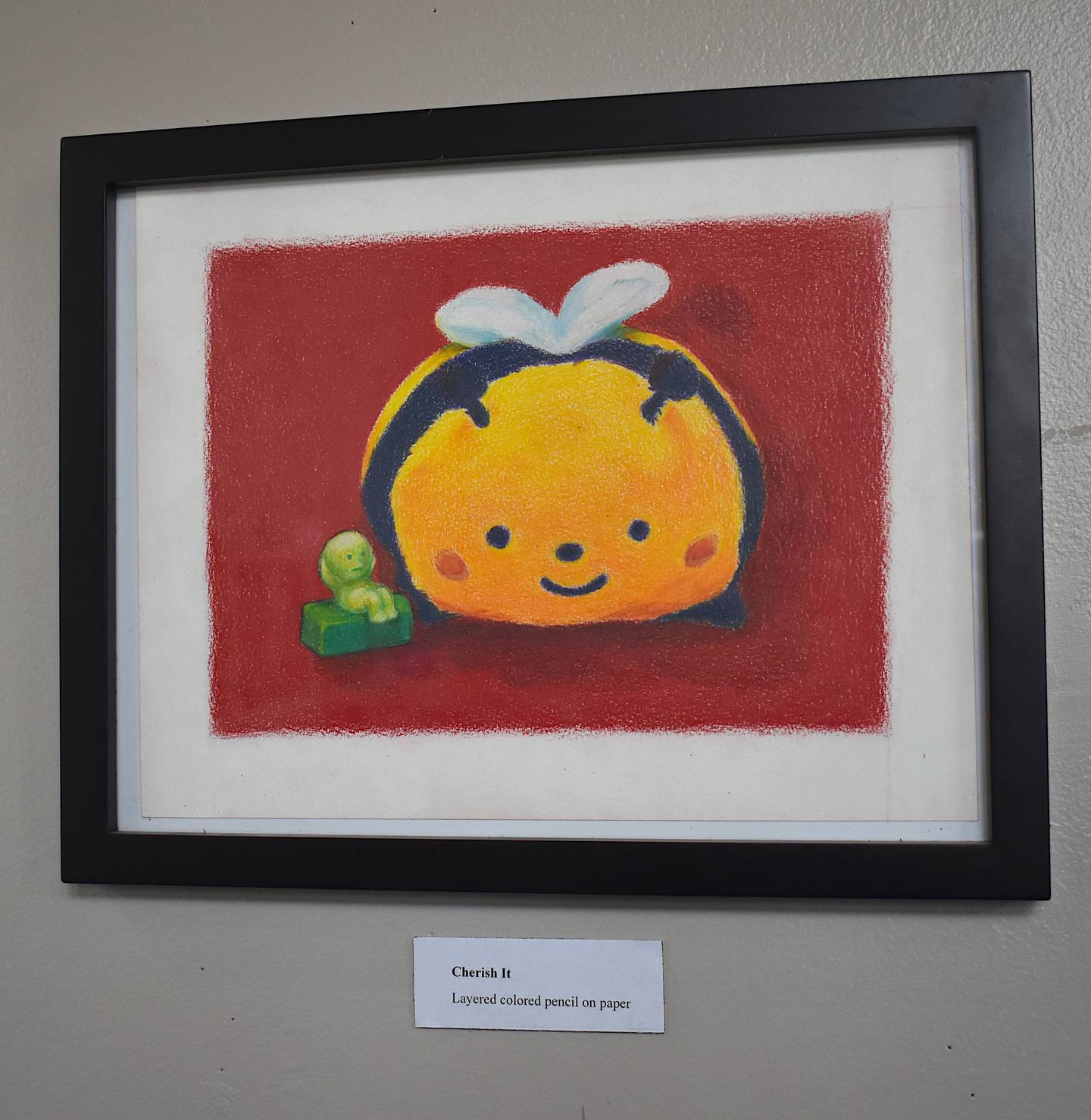 "Cherish It," showcasing a colored pencil drawing by McKinney.