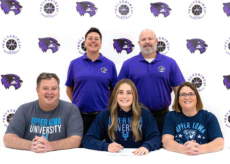 Joined by parents David and Tisha Davis, girls assistant basketball coach Amy Sivadge and head coach Brian Eisbach, Lindsey Davis signs her national letter of intent to play womens basketball beginning next year at Upper Iowa University.