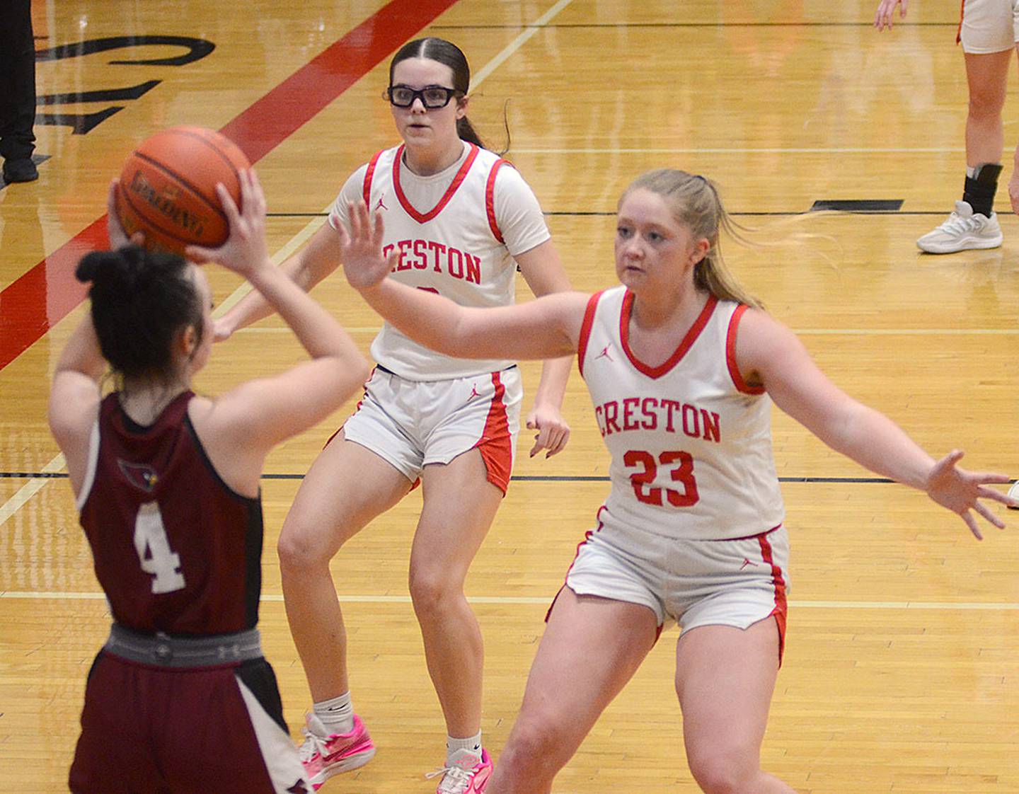 Creston's Brynn Tussey (23) and Braylee Pokorny defend Kylie Meier of Clarinda during Tuesday's game.