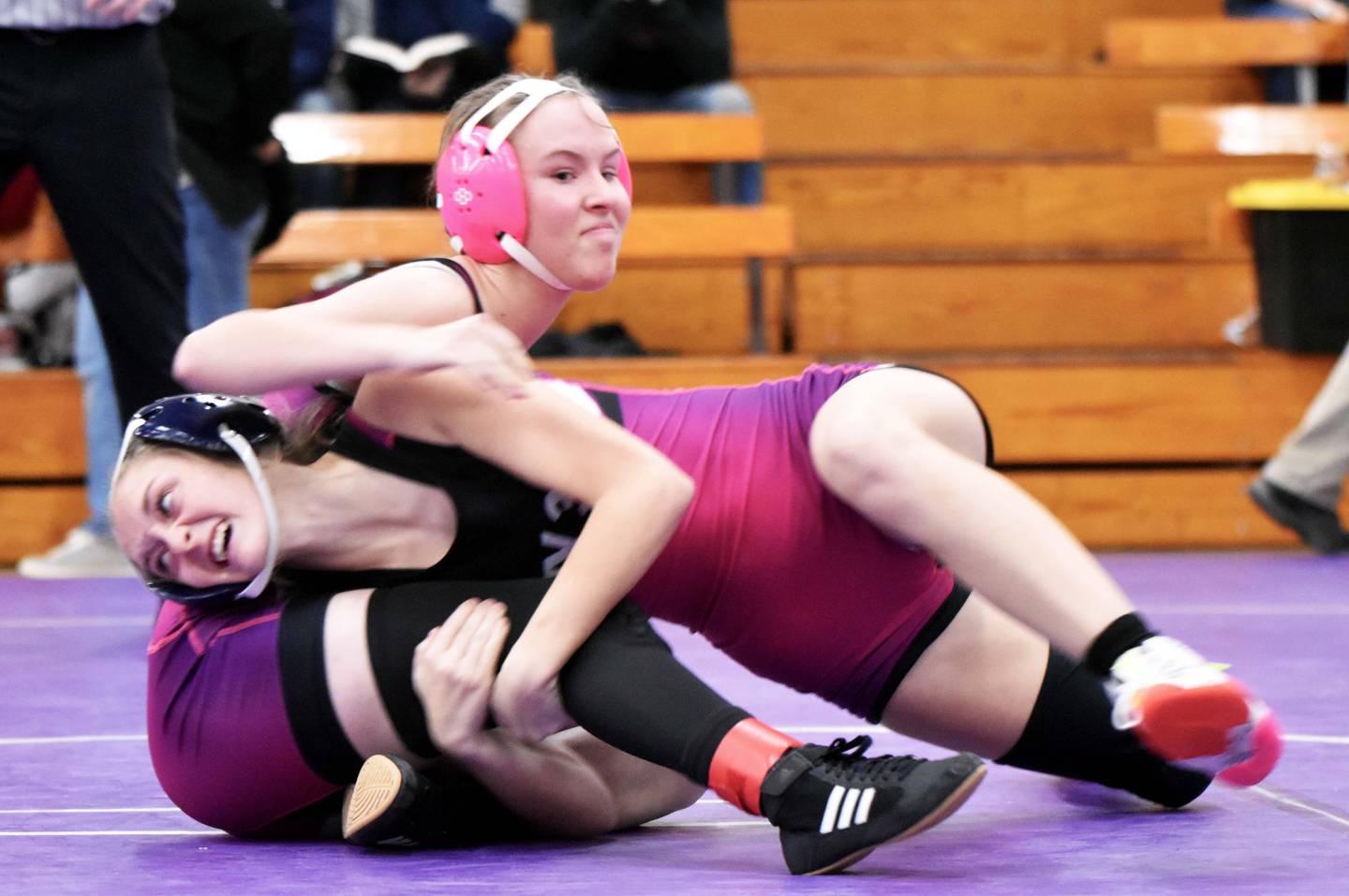 Highway 34 wrestlers Quinn Foster, left, and Hope Woods, right, faced off in the first round at 105 lbs. Foster won the bought with a first-period pin and went on to get second in the class.