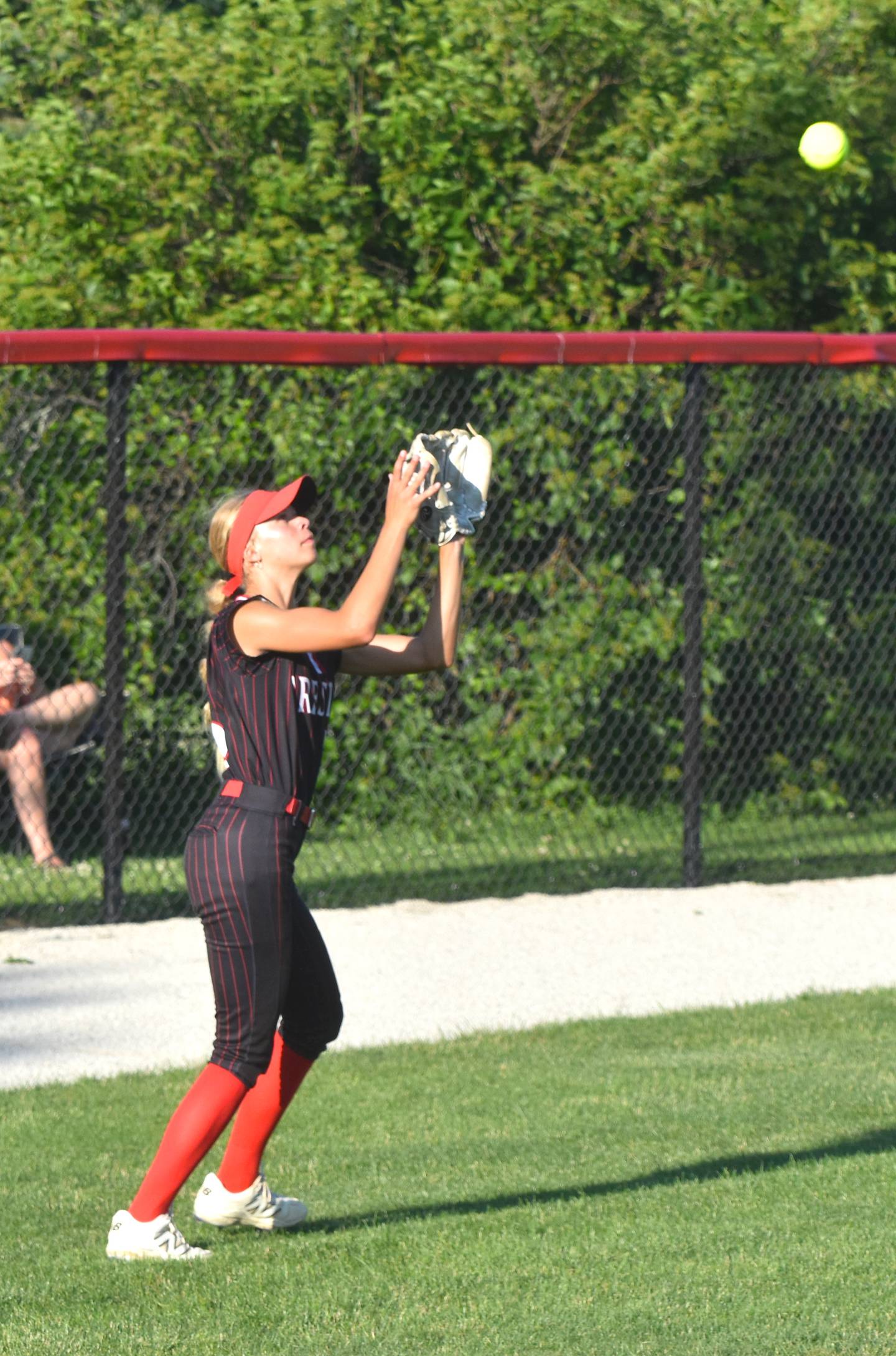 Cora Smith receives a fly ball in the first game against Kuemper Catholic Wednesday.