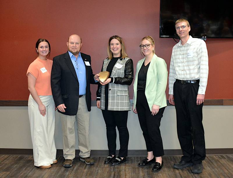Adair County Health System officials receive Midwest Parntership Economic Development's Entrepreneuerial Economic Impact Award, presented by Scott Tonderum (second from left), during the organization's annual dinner Thursday, Jan. 30 at the Casey Community Center. From left are Bailey McLaughlin, ACHS Marketing Director; Tonderum; Catherine Hillestad, ACHS CEO; Jackie Morris, ACHS Executive Assistant and Foundation Director and Dr. Tim Piearson, DO, ACHS Primary Care/Occupational Medicine Provider and Medical Director.