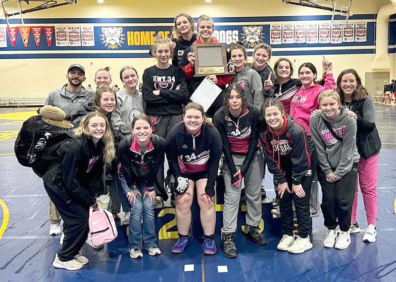 The Highway 34 team is shown with the championship trophy after winning the Riverside Invitational Friday in Oakland.