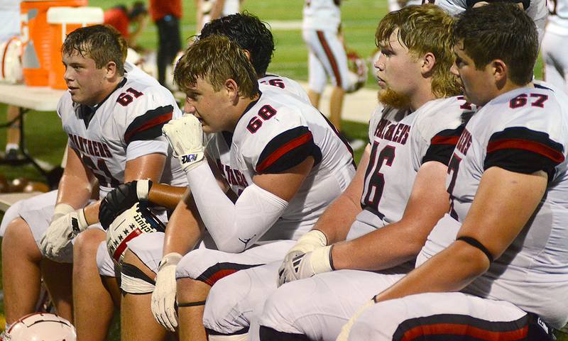 Creston offensive linemen view the previous possession on videotape along the sideline while the defense is on the field vs. Des Moines Christian Friday night. Coach Brian Morrison said the line's improvement was a key in scoring a season-high 31 points Friday.