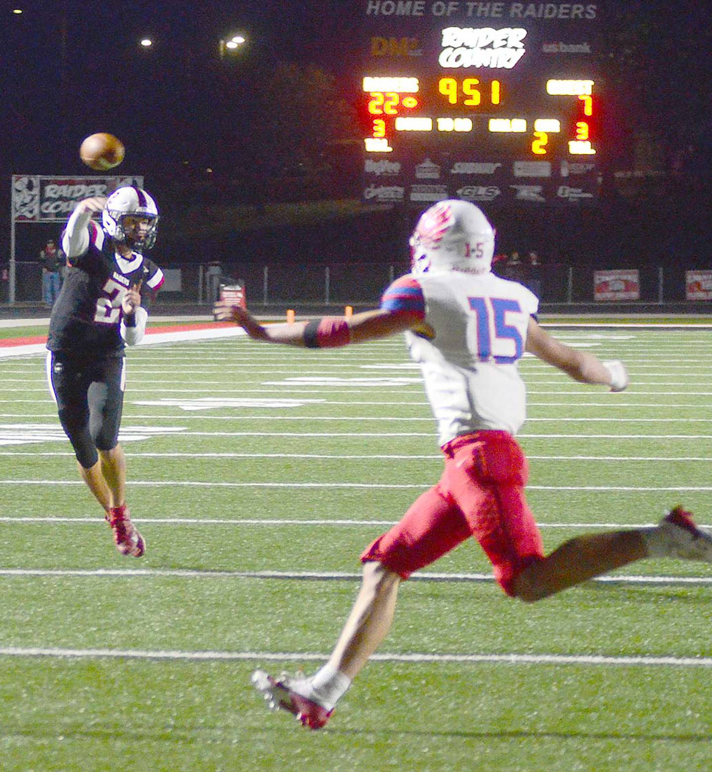 Mount Ayr quarterback Jackson Ruggles releases a pass while rolling out Friday as Earlham's Caleb Smith (15) defends on the play. Ruggles ran for 60 yards and two touchdowns and completed seven passes for 76 yards and a TD. He also returned an interception 58 yards for a touchdown in the fourth quarter.