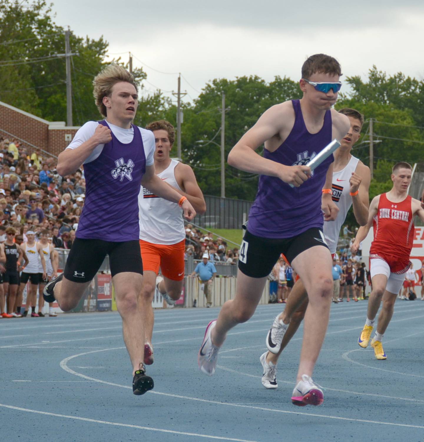 Nodaway Valley's Titan Foster takes the baton from Logan Lantz on the boys distance medley at state track and field last Friday afternoon.