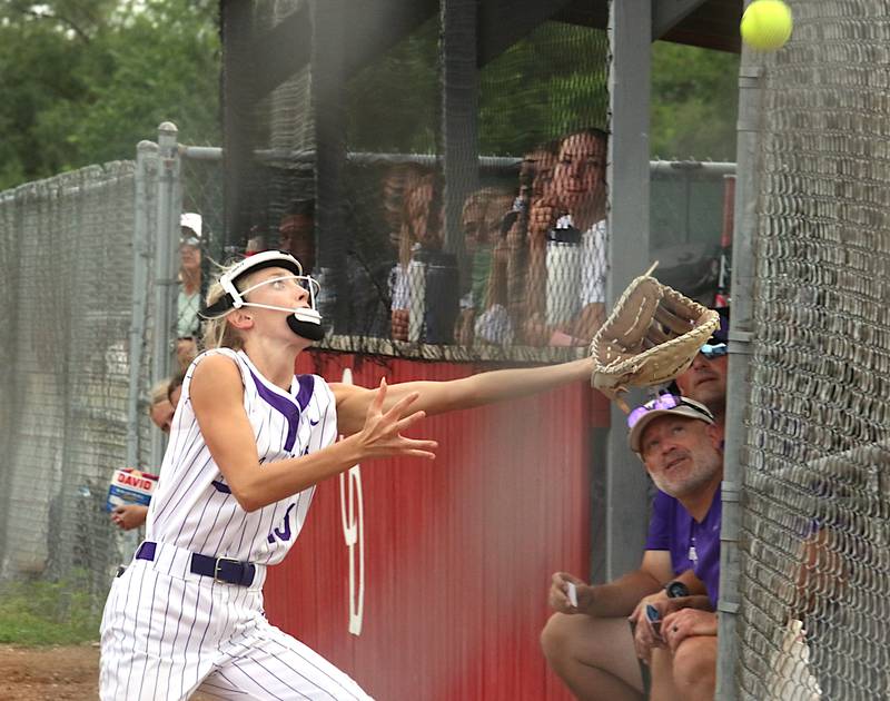 Wolverine junior Izzy Eisbach tracks a pop up into foul territory during a softball game with Central Decatur in Leon.