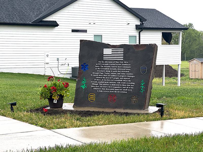 A memorial placed on a corner along Southwest Second Street in Greenfield thanks those who have come to help the town after the tornado and those whose lives were lost.