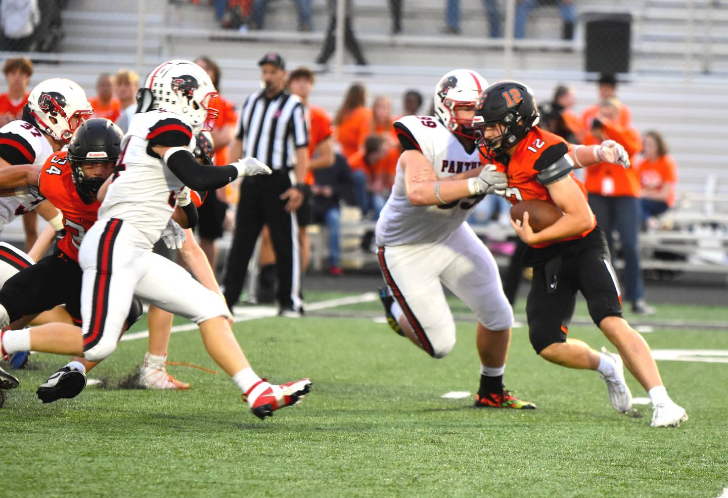 Creston's Max Chapman (No. 99) gets a tackle on Carroll quarterback Carter Essick while Milo Staver (No. 34) gets around a block to come in for the assist. Chapman had six solo tackles including four tackles for loss.