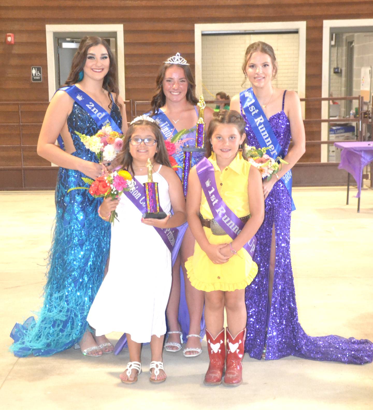 The 2024 Union County Fair Queen and Princess were Lilly James, center back row, and Riley Veitz, front center. Pictured with them are, front from left, second runner up Wynter Lilienthal, Veitz and first runner up Wylee McFarland. In the back row is second runner up Ashlyn Baker, James and first runner up Hannah Woods.