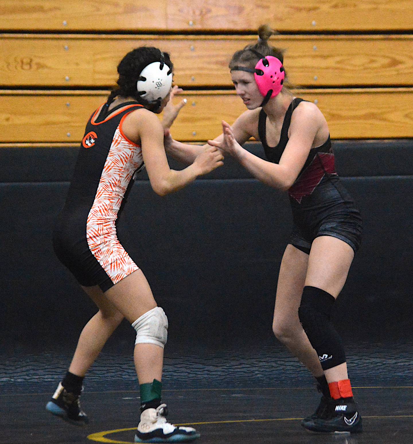 Valkyrie wrestler Jazz Christensen hand fights with a Carroll wrestler in a match at Atlantic.