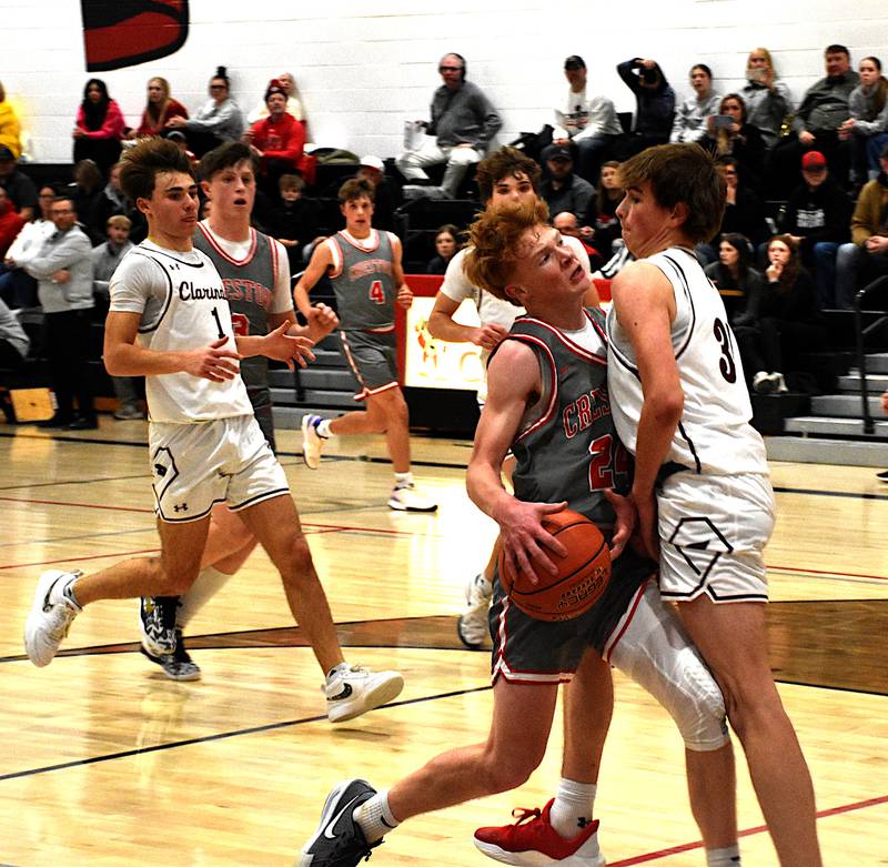 Creston's Tanner Ray runs into Clarinda's Cain Wellhausen Tuesday during Creston's 70-55 win. Ray finished with 18 points.