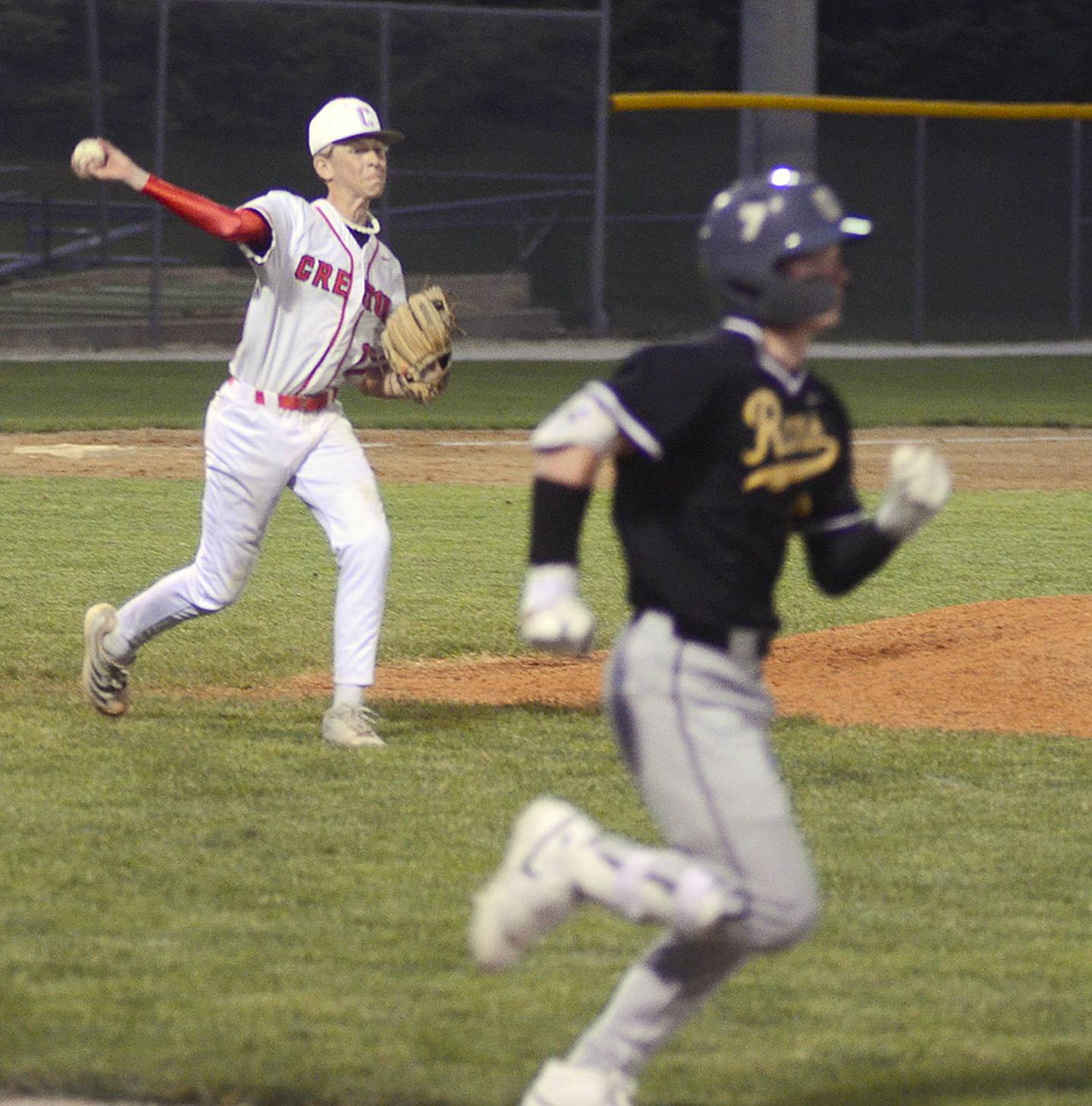 Creston pitcher Landyn Scherer throws to first base after a Glenwood bunt. Scherer pitched four shutout innings in relief of starter Parker Varner.