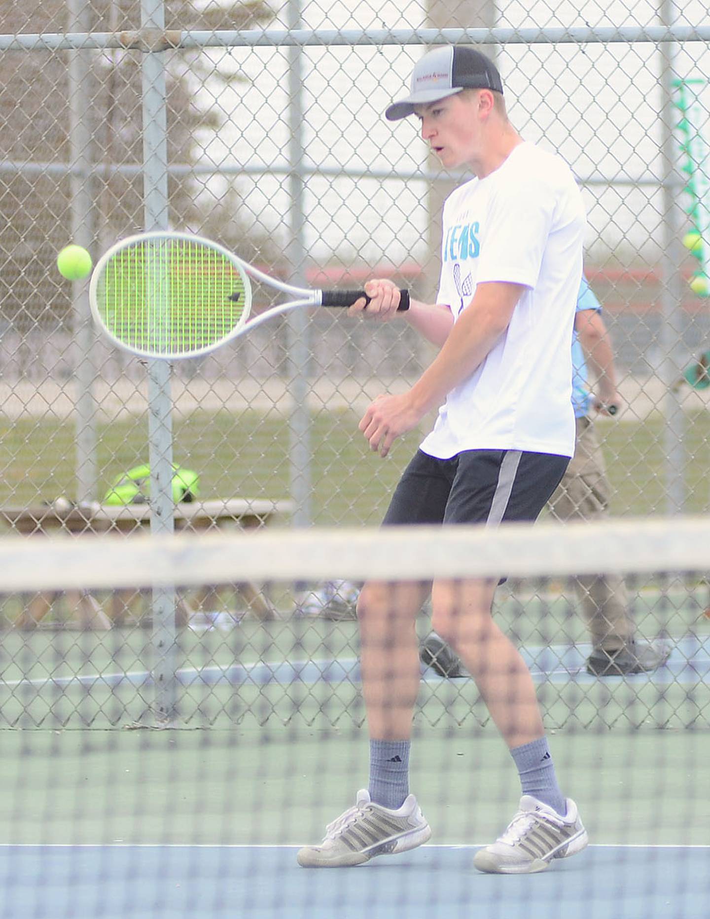 Southwest Valley's Matthew Means returns a shot against Creston's Spencer Brown on the way to winning 8-4 at No. 1 singles Monday.