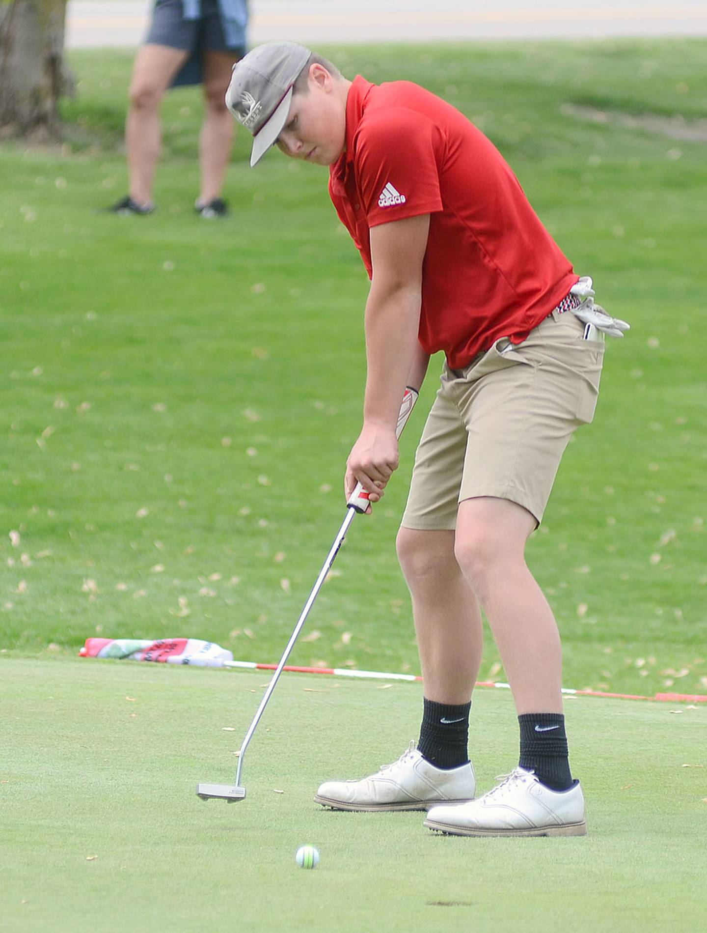 Creston's Marshall Long guides a putt toward the hole on the No. 9 green at Crestmoor Golf Club during Wednesday's Hawkeye Ten tournament. Long had Creston's second-lowest round of 87.
