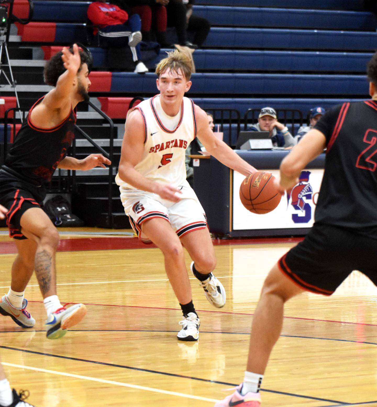 Patrick Worrell splits defenders as he keeps the ball moving. Worrell had seven points agains North Central Missouri College.