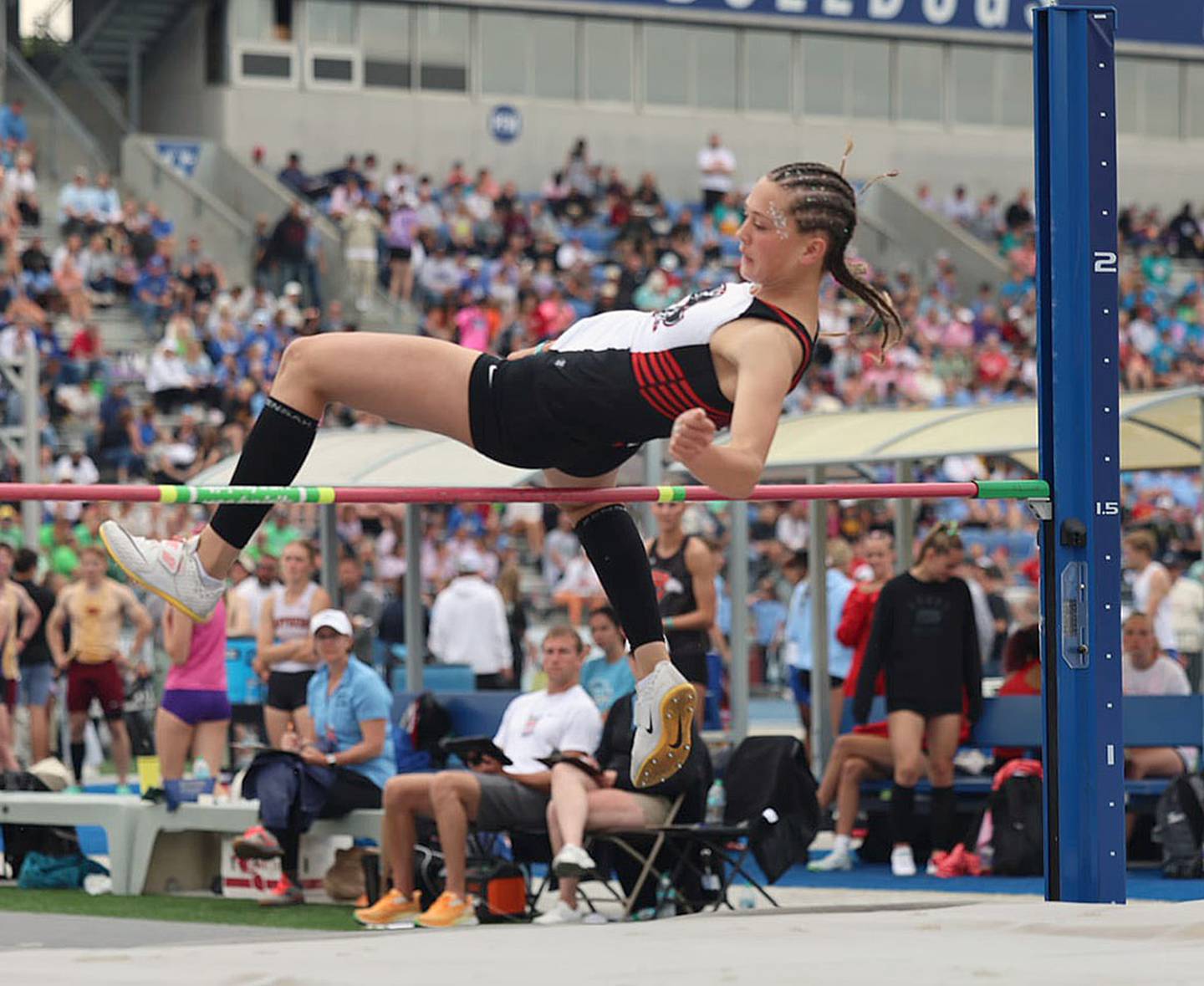 Aubree Shields of Mount Ayr clears the bar at the Class 1A high jump competition Friday. Shields tied for third at 5-02. It was her third year on the podium at state.