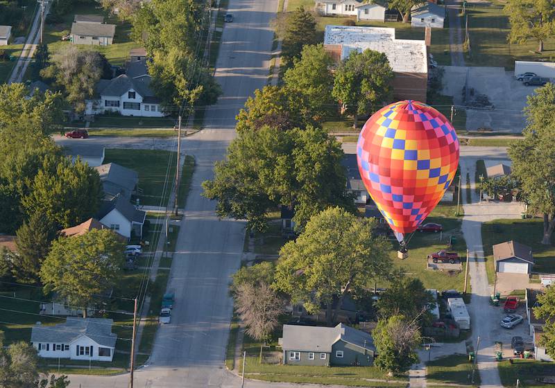 A hot air balloon drifts over Creston during last year's Balloon Days Friday fun flight. This would become the only chance for balloons to fly in 2024.