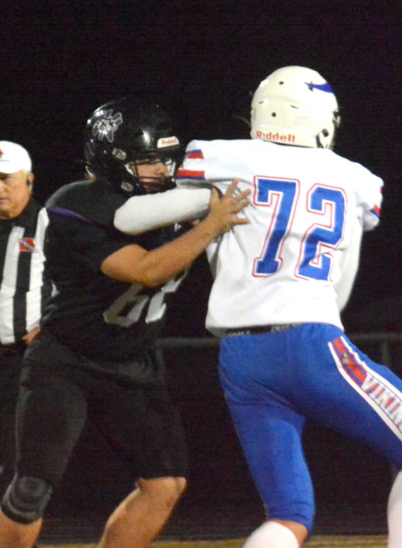 Wolverine senior Wyatt Boden blocks his man from AHSTW during Friday night's game.