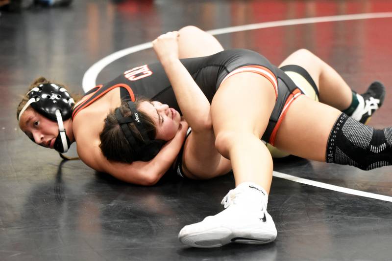Alainah Galanakis of Creston looks to the ref as she holds Glenwood’s Layla Daugherty to the mat Tuesday in a home triangular with Glenwood and Clarke. The Panthers won both duals.