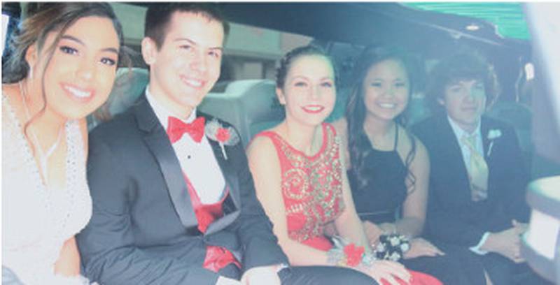 Creston Community High School students, from left, Jessica Arevalo, Noah Fargo, Miranda Austin, Karmen Chuong and Garrett Dahl ride in style in a stretch limo for the 2018 CCHS prom.