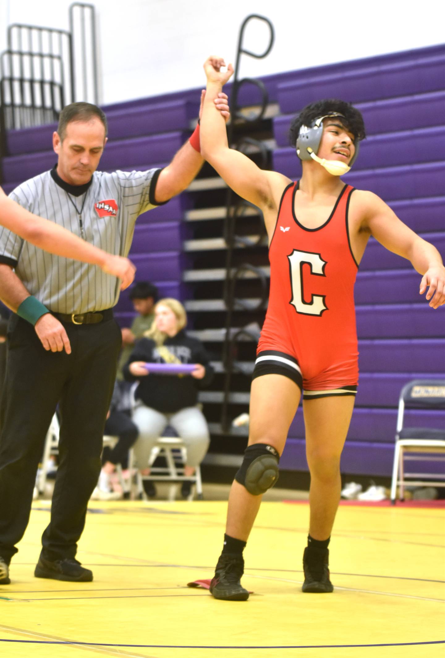 Creston freshman Jose Avila celebrates an upset win over Isaac Bates of Lewis Central in the consolation semifinals. Avila came in seeded fifth at 150 but placed fourth.