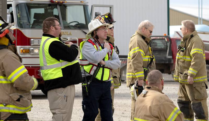 Creston Fire Chief Todd Jackson, center, asseses the situation Wednesday as Creston was called by Osceola to assist with a fire at a grain elevator. Murray was also called for help. Osceola was able to control the fire not needing the assistance from the other departments.