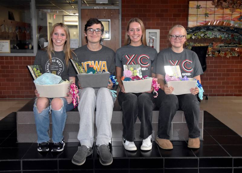The Creston cross country team graduates four seniors. From left, Karter Clayton, Spencer Brown, Payton Davis and manager Savanna Davis. They were honored Sunday at the banquet.