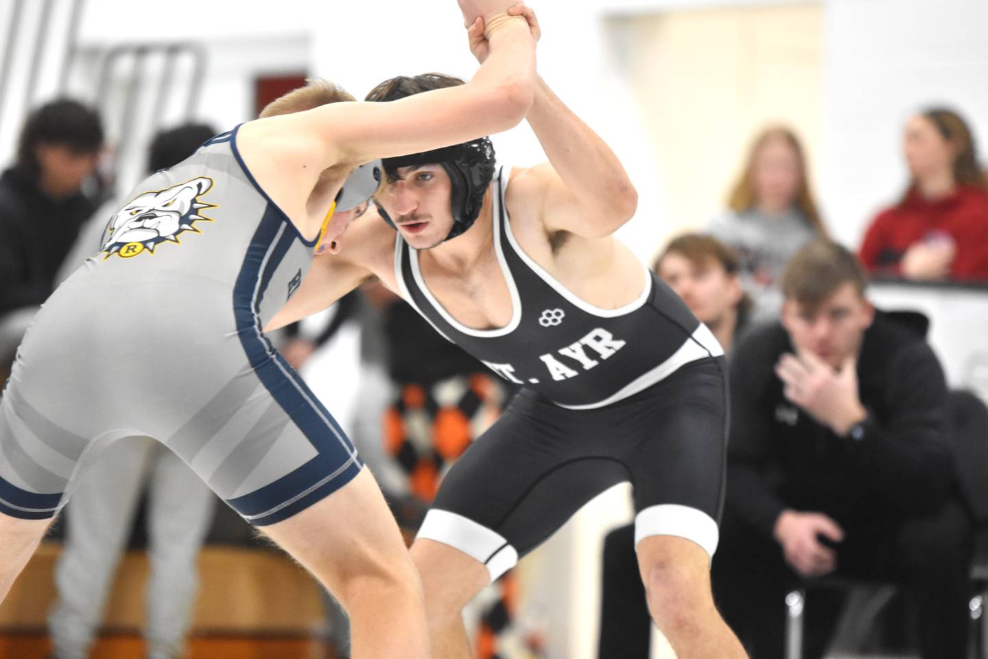 Bryson Martin of Mount Ayr, left, looks for a takedown against Rex Shanno of Riverside, Oakland in the consolation semifinals. Martin went on to take fifth at 132.