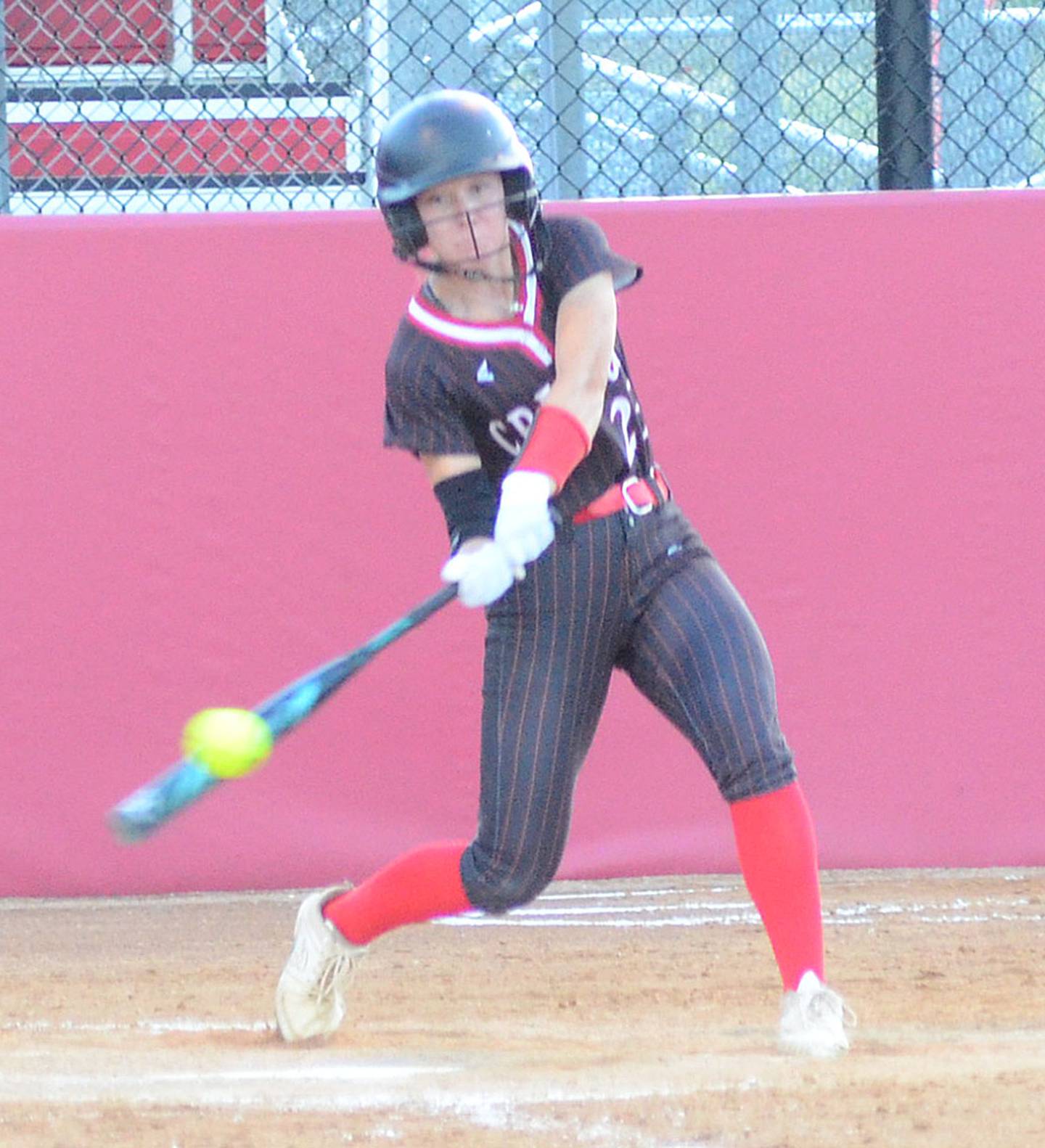 Creston's Avery Staver connects with a pitch during Tuesday's regional final game at Dallas Center-Grimes. Staver hit a single in the fourth inning.